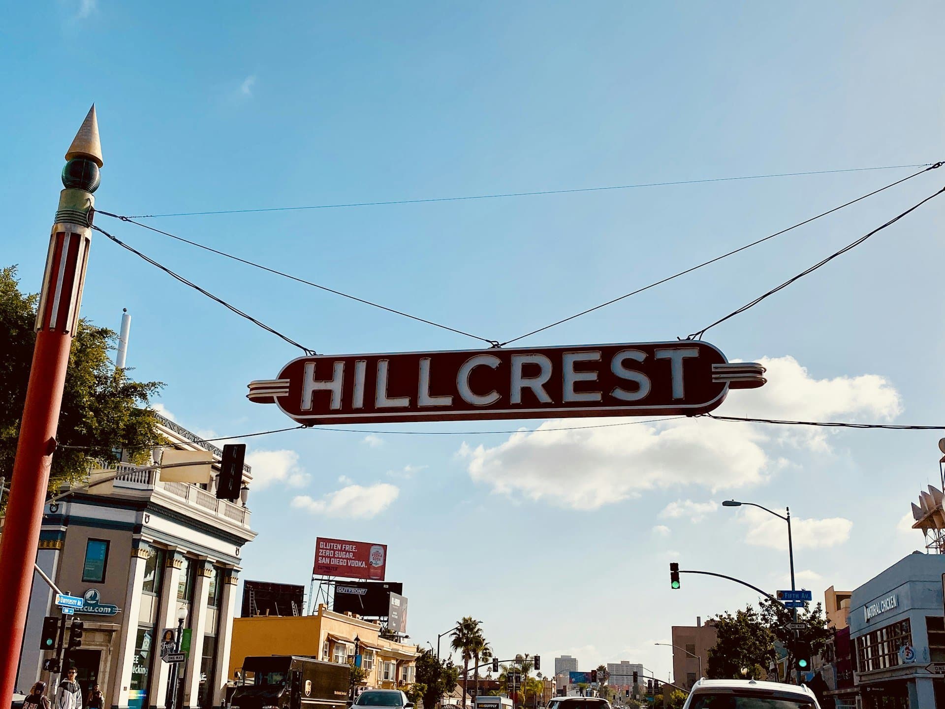 The Hillcrest neighborhood sign under a blue sky