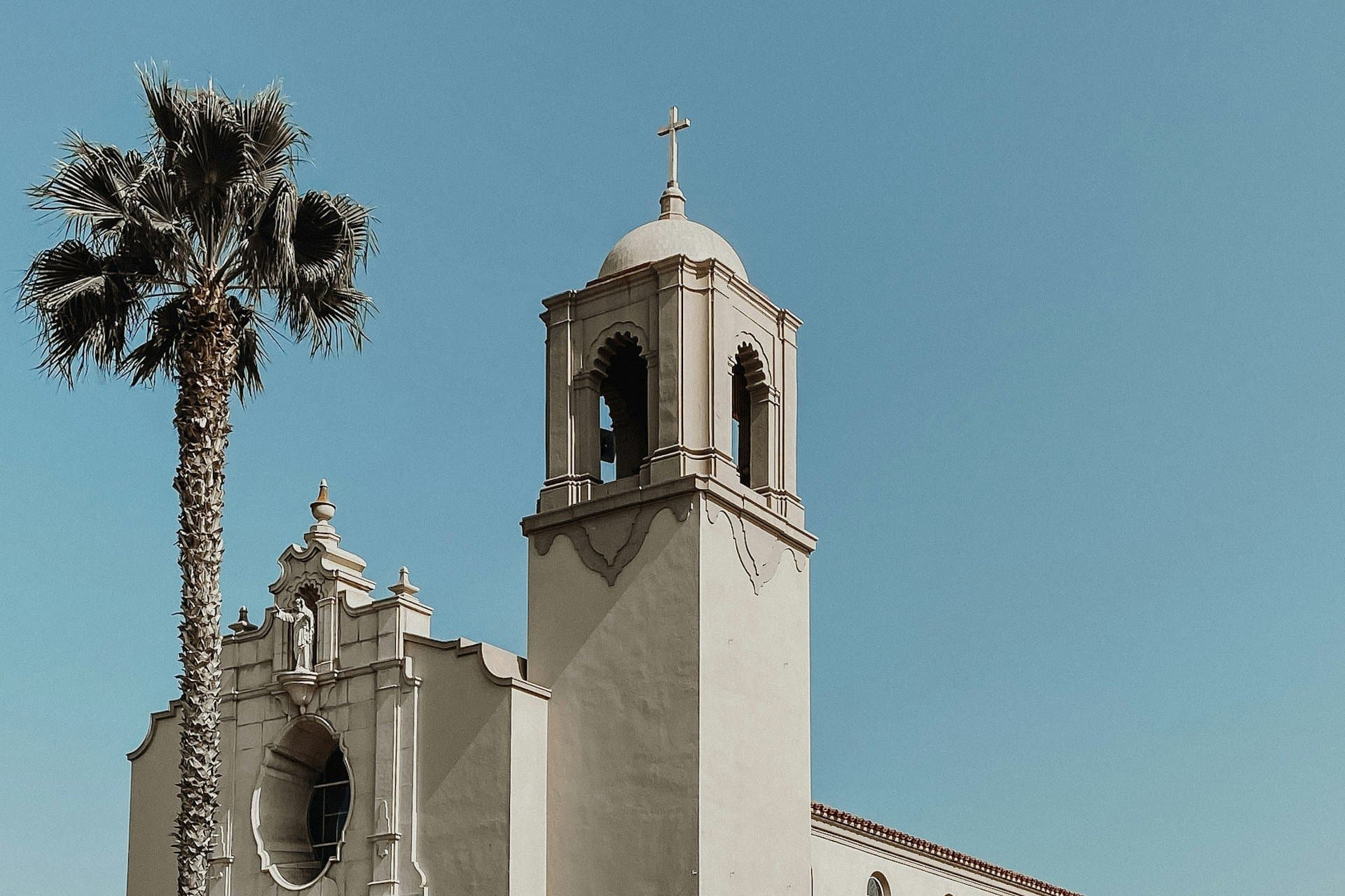 Mission-style bell tower and palm in the San Diego River valley